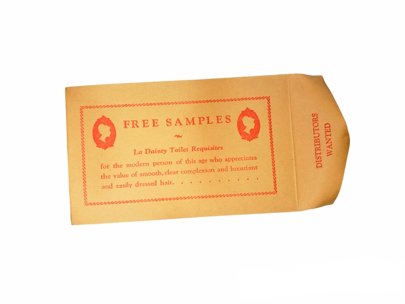 May include: A brown paper envelope with red text that reads "FREE SAMPLES" and "La Dainty Toilet Requisites" for the modern person of this age who appreciates the value of smooth, clear complexion and luxuriant and easily dressed hair. The envelope also has red text that reads "DISTRIBUTORS WANTED".