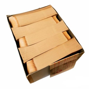 May include: A cardboard box filled with stacks of old, yellowed paper. The box is labeled "REGISTRAR."