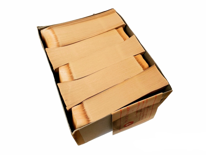 May include: A cardboard box filled with stacks of old, yellowed paper. The box is labeled "REGISTRAR."