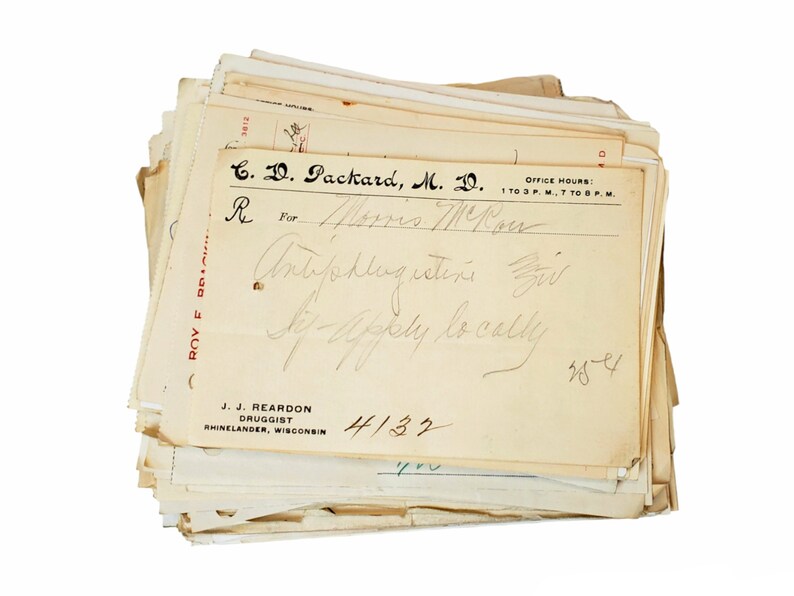 May include: A vintage prescription form from C. D. Packard, M.D. with handwritten text for "Mos Mou" for "Antiphlogistine" to be applied locally. The form is dated 4/13/32 and 28-4.