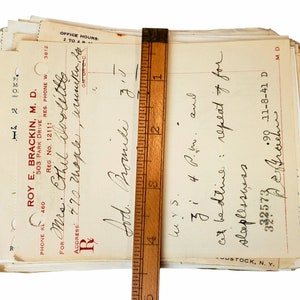 May include: A stack of old medical prescription forms with handwritten notes. The top form is for "Mrs. Ethel Doolittes" and includes the text "Lod. Bromide" and "cit bedtive: repeat of for slaplesswss".