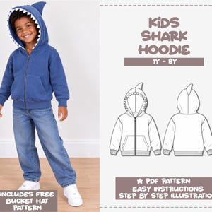 May include: A blue zip-up hoodie with a shark-themed hood featuring white teeth, paired with blue jeans and white sneakers. The graphic includes the text KIDS SHARK HOODIE 1Y-8Y, PDF PATTERN, EASY INSTRUCTIONS, STEP BY STEP ILLUSTRATION, and INCLUDES FREE BUCKET HAT PATTERN.