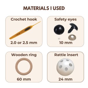 May include: An informational graphic titled MATERIALS I USED displaying four craft items: a yellow 2.0 or 2.5 mm crochet hook, 10 mm black safety eyes with washers, a 60 mm wooden ring, and a 24 mm white spherical rattle insert with holes.