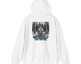 May include: White hooded sweatshirt with a graphic print of a skeleton sitting in a forest with pumpkins and the text "Chill vibes only..."