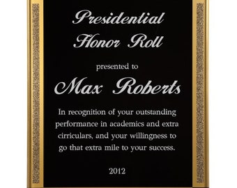 May include: Black plaque with a gold border and a gold glitter design. The plaque has the text "Presidential Honor Roll" and "presented to Max Roberts". The text continues with "In recognition of your outstanding performance in academics and extra curriculars, and your willingness to go that extra mile to your success." The plaque is dated "2012".