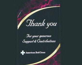 Puede incluir: Una placa de premio de acrílico negro y rojo con un borde dorado. La placa tiene el texto "Gracias" y "Por su generoso apoyo y contribuciones". También se incluye el logotipo de la Cruz Roja Americana.