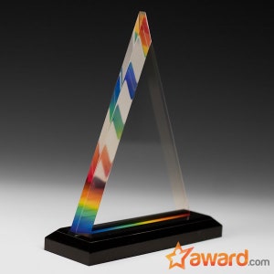 May include: A clear acrylic triangle award with a rainbow prism design. The award has a black base.