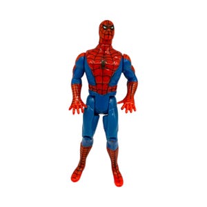 May include: A Spider-Man action figure in a standing pose. The figure is predominantly red and blue, with a detailed web pattern on the red sections. The figure has a black spider emblem on the chest and red hands and feet.