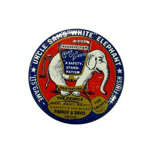 May include: A vintage, circular political campaign button with a white elephant illustration. The button has a red background with blue text that reads "Uncle Sam's White Elephant." Text includes "Rooseveltism" and "Parker & Davis 1904."
