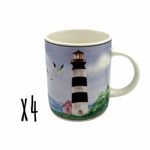May include: A ceramic mug featuring a painted scene of a black and white striped lighthouse, a small pink building, green foliage, and two birds flying in a light blue sky. The mug has a white interior and a handle on the right side. The text X4 is visible.