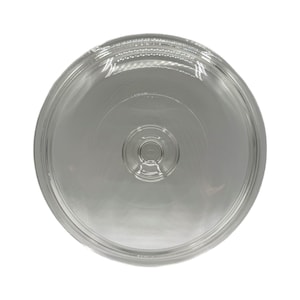 May include: A clear, circular glass lid with a slightly domed shape. The lid has a raised rim and a small, circular handle in the center. The glass is transparent, allowing a view of what it covers. The design is simple and functional.
