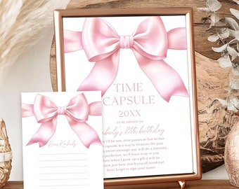 May include: A pink and white time capsule card with a pink bow and the text "Time Capsule 20XX In celebration of baby's 18th birthday". A matching pink and white card with a pink bow and lines for writing is also included.