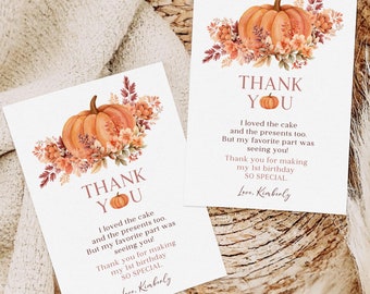 May include: Two thank you cards featuring a pumpkin and autumn foliage design. The text on the cards reads "Thank You" and includes a message about a first birthday.