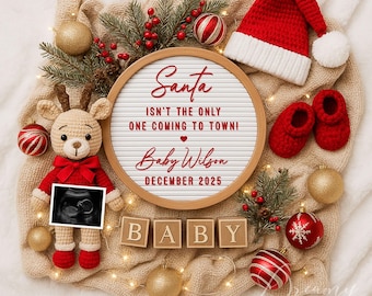 May include: A white letter board with the text "Santa isn't the only one coming to town! Baby Wilson December 2025" in red lettering. The letter board is surrounded by Christmas decorations, including a red Santa hat, a crocheted reindeer holding an ultrasound image, and red and gold ornaments.