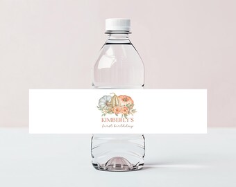 May include: Water bottle label with a watercolor illustration of pumpkins and fall foliage. The label says "Kimberly's first birthday".