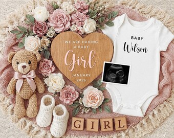 May include: A baby announcement with a wooden heart sign saying "We are having a baby Girl January 2026". Includes a white babygrow with "Baby Wilson", a teddy bear, baby booties, flowers, and a sonogram image.