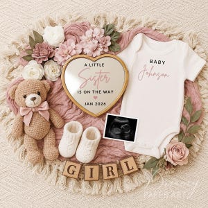May include: A baby announcement with a heart-shaped mirror that reads "A Little Sister Is On The Way" and "Jan 2026". The announcement includes a white onesie, a teddy bear, baby booties, and a sonogram image. Wooden blocks spell out "GIRL".