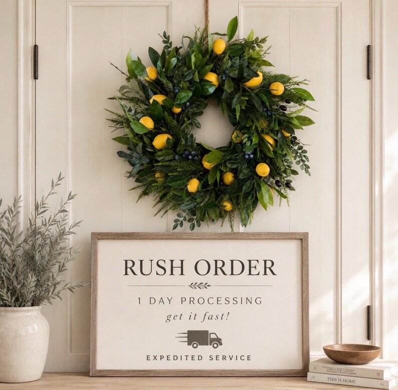 May include: A circular wreath featuring green leaves and yellow lemons hanging above a rectangular sign with the text RUSH ORDER, 1 DAY PROCESSING, get it fast!, and EXPEDITED SERVICE, accompanied by a truck icon and a small wooden bowl.