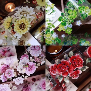 May include: A collage of decorative floral washi tapes. The tapes feature detailed designs of sunflowers, clovers, roses, and other flowers in various colors. The tapes are on a transparent background, with a warm, inviting aesthetic.