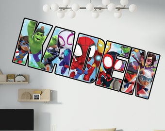 May include: A wall decal featuring the name "KADEN" spelled out in large, black letters. Each letter is filled with a different superhero character from the Marvel universe, including Spider-Man, Iron Man, and Hulk.