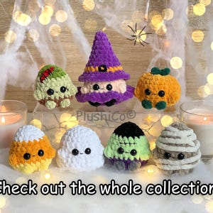 May include: A collection of handmade crochet Halloween plushies, including a witch, pumpkin, mummy, ghost, candy corn, and Frankenstein's monster. The plushies are in various colors and sit on a bed of white fabric. The text "Check out the whole collection" is at the bottom.