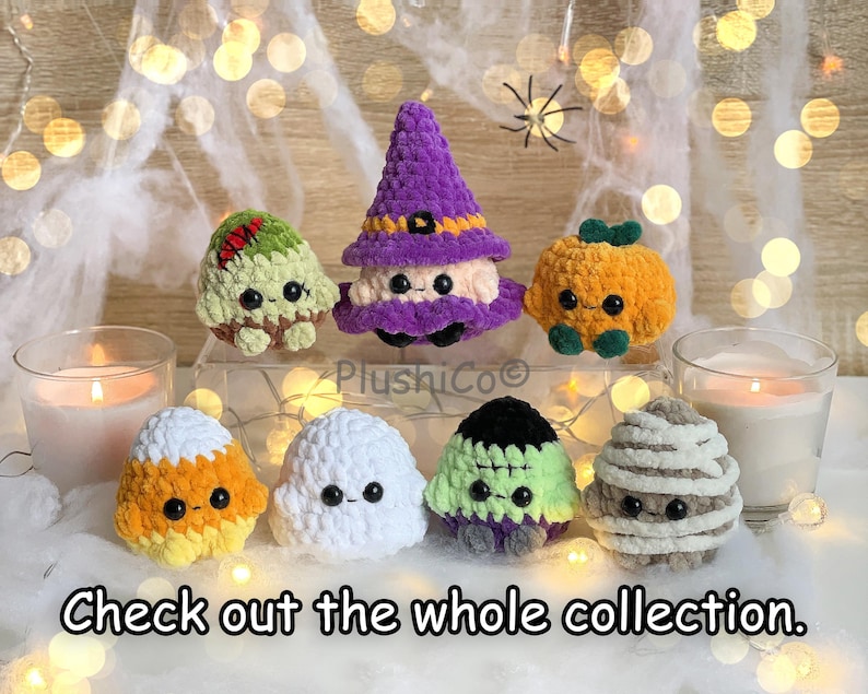 May include: A collection of handmade crochet Halloween plushies, including a witch, pumpkin, mummy, ghost, candy corn, and Frankenstein's monster. The plushies are in various colors and sit on a bed of white fabric. The text "Check out the whole collection" is at the bottom.