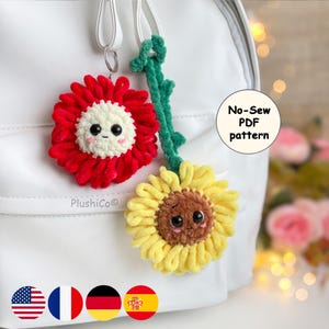 May include: Two plush sunflower keychains with smiling faces. One is red with a white center, the other is yellow with a brown center. A green stem connects the yellow flower. The text "No-Sew PDF pattern" is visible.