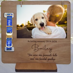 May include: Wooden photo frame with a blue and white patterned dog collar, a photo of a dog and a person, and the text "In loving memory 2019-2024 Bailey You were our favourite hello and our hardest goodbye".