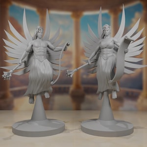 May include: Two grey angel statues with outstretched wings, holding a staff and a scroll. The statues have detailed musculature and flowing robes, standing on circular bases. The background features a blurred architectural setting.