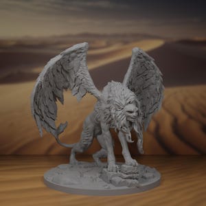 May include: A grey, detailed, 3D printed miniature of a winged lion with a human-like face. The lion is standing on a rocky base and has its wings spread out.