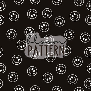 May include: Black and white seamless pattern featuring a repeating design of stylised smiley faces with dots for eyes. The text "bloom pattern" is centred in the image.