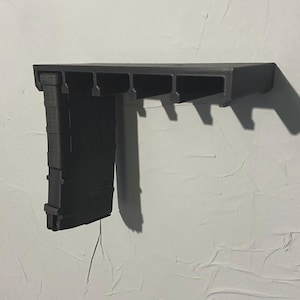 Pmag  MAGPUL  7.62x51 / .308 Winchester, 8.6 blackout wall mounted magazine holder. Holds 5 magazines.gun magazine wall mount ar10 m110 sr25