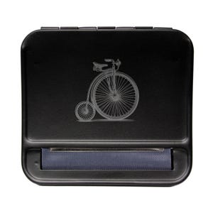 May include: Black metal rolling tray with a built-in roller and an engraved image of a vintage bicycle.