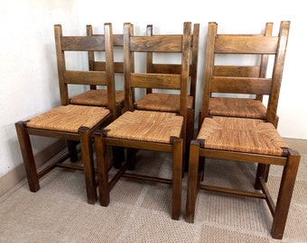 Suite de 6 chaises brutalistes vintage en bois et paille années 70 80