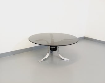 Vintage round coffee table in glass, chrome metal and black metal Space Age style from the 70s