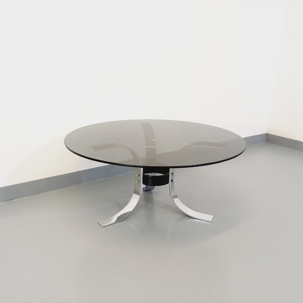 Vintage round coffee table in glass, chrome metal and black metal Space Age style from the 70s