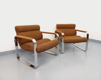 Par de sillones vintage de Eero Aarnio para Framac, en tela y cromo, de los años 60 y 70.
