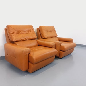 Pair of vintage leather lounge chairs from the 60s and 70s