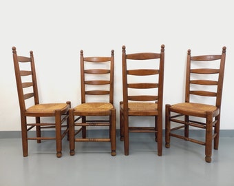 Suite de 4 chaises brutalistes Charles Dudouyt vintage en bois et paille des années 60