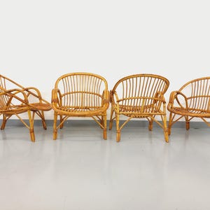 Set of 4 vintage rattan armchairs from the 60s