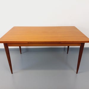 Vintage Scandinavian style rectangular dining table from the 50s 60s in teak with extensions