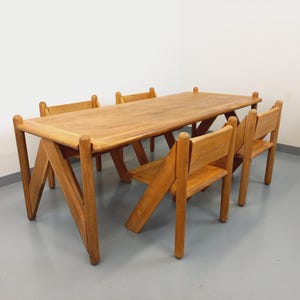 Exceptional set of a large rectangular table and 4 vintage brutalist chairs in solid oak wood from the 60s and 70s