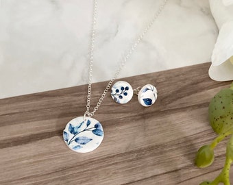 Handmade blue floral earrings and necklace // polymer clay and sterling silver // navy blue and white floral leaf design studs and pendant