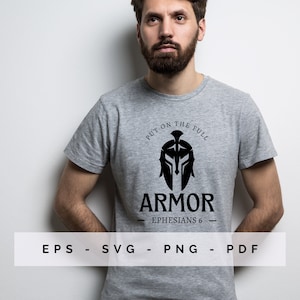 May include: A grey t-shirt with a black Spartan helmet graphic and the word "ARMOR" beneath. The text "PUT ON THE FULL" curves above the helmet, and "EPHESIANS 6" is written below. The shirt also displays "EPS - SVG - PNG - PDF".