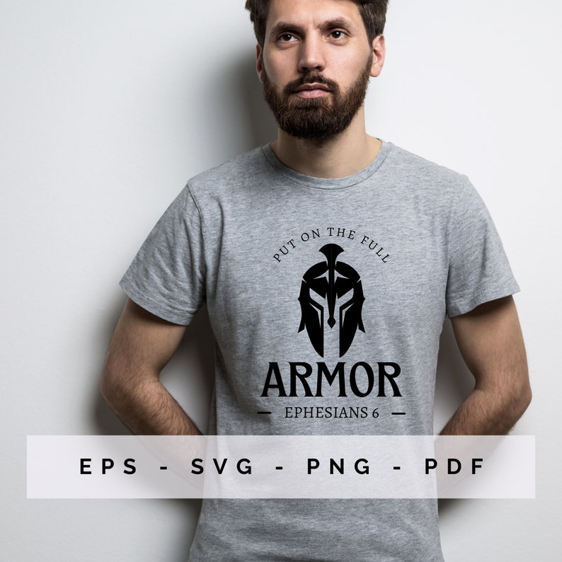 May include: A grey t-shirt with a black Spartan helmet graphic and the word "ARMOR" beneath. The text "PUT ON THE FULL" curves above the helmet, and "EPHESIANS 6" is written below. The shirt also displays "EPS - SVG - PNG - PDF".