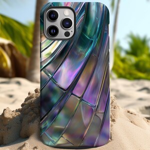 May include: A phone case with a iridescent, multi-colored, abstract design. The case has a black background with a pattern of overlapping, curved lines in shades of blue, purple, and green.