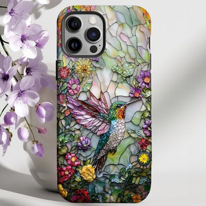 May include: A stained glass style phone case featuring a hummingbird in flight surrounded by colorful flowers. The case is designed for an iPhone.