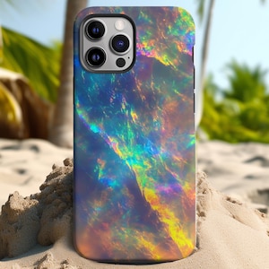 以下が含まれることがあります： 虹色のオパール模様の携帯電話ケース。ケースは耐久性のある素材で作られており、洗練されたモダンな外観です。