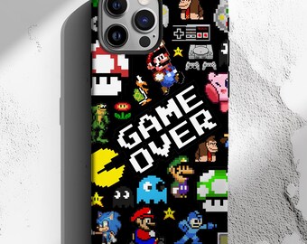 May include: Black phone case with a pixelated design featuring characters from popular video games. The case has a variety of colors, including red, blue, green, yellow, and white. The text "GAME OVER" is prominently displayed in the center of the case.