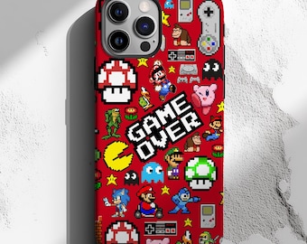 May include: Red phone case with a pixelated design featuring classic video game characters and icons. The case includes the words "GAME OVER" in white block letters. The design includes mushrooms, stars, and characters like Mario and Pac-Man.